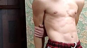 Skinny flexible boy shows off muscular body after study session