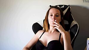 Busty Brunette Smoking In Black Bra