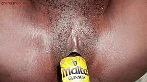 Onion booty ebony Ghana girl fucks malt bottle with big ass shaking. 😏