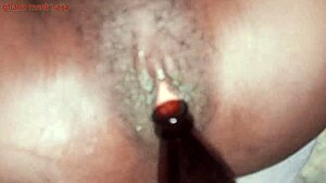 Onion booty ebony Ghana girl fucks malt bottle with big ass shaking. 😏