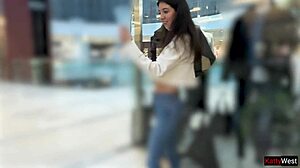 Teen girl pees in jeans publicly at shopping mall during sporty outdoor flashing.