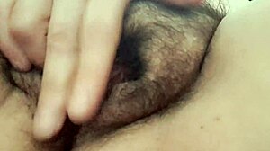 Mature MILF wife with natural tits and hairy pussy warms up beaver in close-up homemade solo