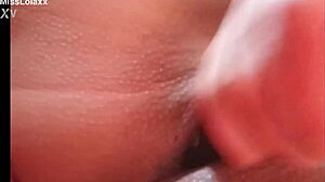 Sensual latina teen masturbates with dildo on bed showing wet pussy lips close-up