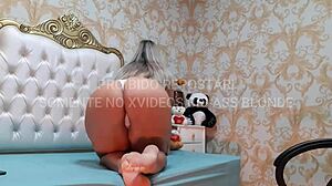 Blonde latina milf dances sensually in white and black lingerie.