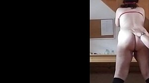 esclave endures flagellation and submission as the gagged slave in bondage with chains and handcuffs