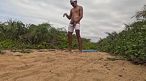 handjob cumshot erupts on beach sands