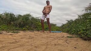 handjob cumshot erupts on beach sands