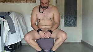 Domina Amysexxxjuguetona casually crushes her submissive's balls under shiny patent leather boots in a femdom session