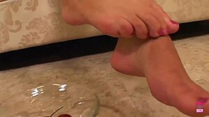 This lovely brunette indulges her boyfriend's foot fetish with deep licks and a teasing footjob all night