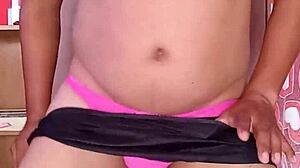 dancing sexy in pink shiny thong nylons and bra