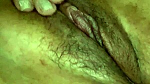 bold closeup of dripping hairy pussy exposed