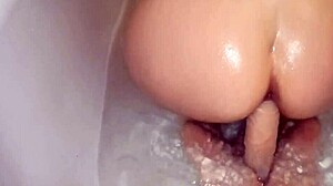 My juicy ass squirts from shower dildo
