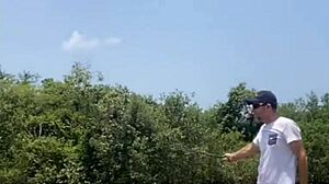 Exhibitionist flashes tiny shorts while fishing outdoors