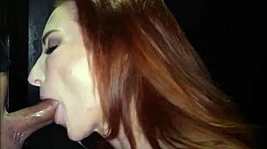 redhead inked milf gags on cocks at gloryhole swallowing loads!