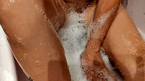 Shy Big Tits Babe Bathes Shaved Pussy