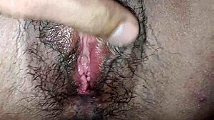 Her tight shaved pussy gushes soaking her swollen clit