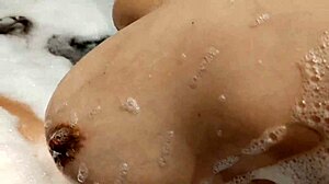 Shy Big Tits Babe Bathes Shaved Pussy