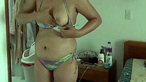 beautiful stepmom flashes bikini curves on beach teasing