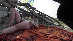 wanna see my teacher flash n rub her wet pussy for beach voyeurs?