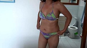 beautiful stepmom flashes bikini curves on beach teasing
