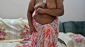 Desi bhabhi Suma sways big boobs seductively in tight Indian tease.