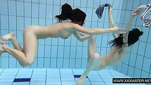 shaved brunette babe's big tits tease underwater