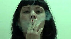 a pretty brunette in bikini smokes cigarettes while sucking black dildo then masturbates her hairy russian pussy to orgasm homemade