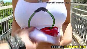 busty blonde amateur babe flashes her huge tits in public bikini tease