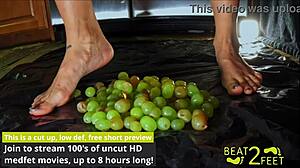 Raven Rogue's feet get drenched sticky grapes smashed wet fetish fun.