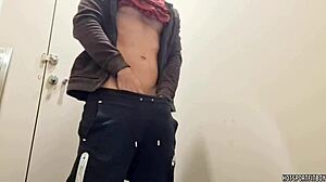 muscular bodybuilder strokes monster cock in public bathroom solo