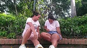 Two horny colombian lesbians finger wet pussies in public park