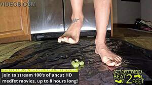 Raven Rogue's feet get drenched sticky grapes smashed wet fetish fun.