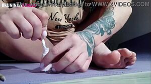 Brazilian beauty paints toenails flashing shaved pussy close-up tease
