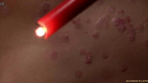 redhead's pussy drips wax then explodes in rough bondage orgasm oops!!