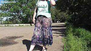 hairy mature flashing her beaver thru see-thru dress outdoors