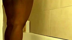 Pretty petite black babe showers prettily