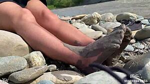 goddess's torn pantyhose reveal messy nylon feet by river closeups