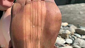goddess's torn pantyhose reveal messy nylon feet by river closeups