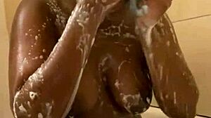 Pretty petite black babe showers prettily