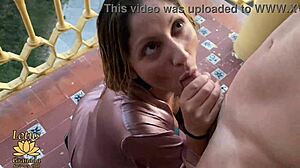 Two Girls Suck Huge Cock on Balcony