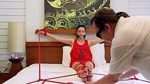 sofi, tied in red ropes on bed, ready for bound hardcore play?