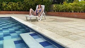 Naughty redhead Andy Rose licks and rides big cock poolside!