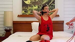 sofi, tied in red ropes on bed, ready for bound hardcore play?