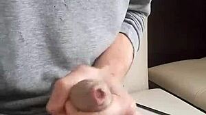 Young man cums hard on massive uncut cock