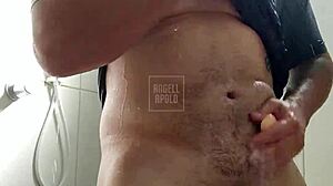 a masked tattooed guy showers solo, plays with his toy till he explodes 😏🚿💦