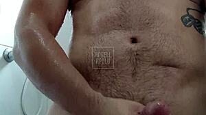 a masked tattooed guy showers solo, plays with his toy till he explodes 😏🚿💦