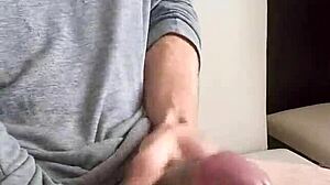 Young man cums hard on massive uncut cock