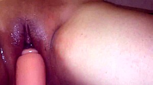 Lover stuffs toy penis deep in pussy for masturbation orgasm