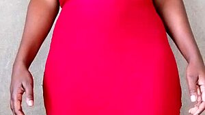 Watch this sexy African lady flash her big tits! 