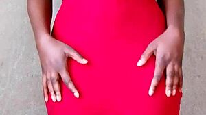 Watch this sexy African lady flash her big tits! 